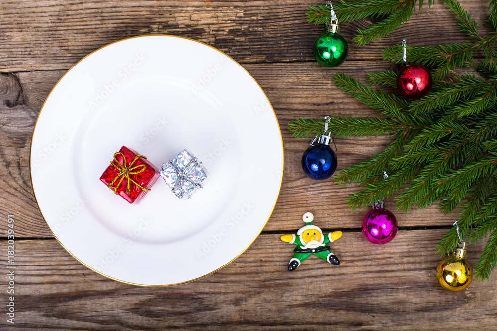 Sticker christmas dinner on background with rustic table decorations. view from above