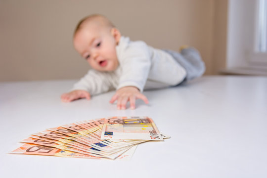 Baby Reaching For Money.