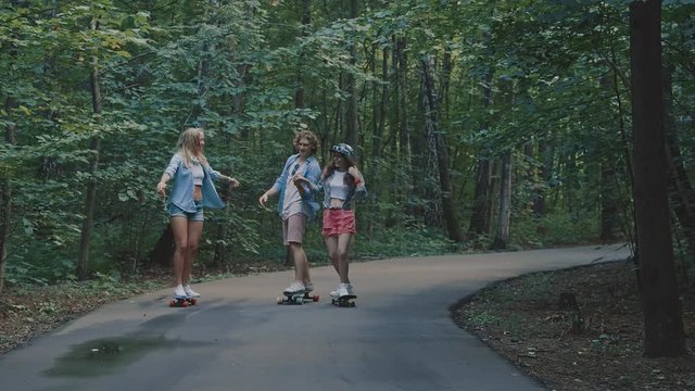 Young people skateboarding in the park
