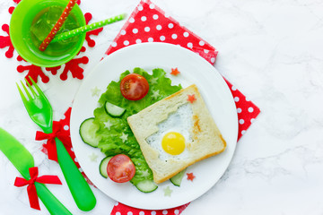 Christmas breakfast fried egg in toast shaped Christmas tree