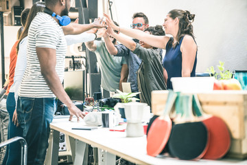 Young employee startup workers group stacking hands at urban studio during entrepreneurship brainstorming project - Business concept of human resources on working time - Start up internship at office