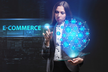 The concept of business, technology, the Internet and the network. A young entrepreneur working on a virtual screen of the future and sees the inscription: E-commerce