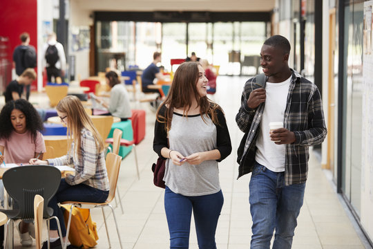 Communal Area Of Busy College Campus With Students