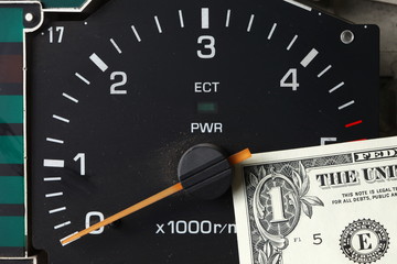 Banknote put tachometer gauge scene.