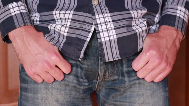 Holding hands in jeans pockets closeup