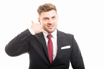 Handsome business man showing contact gesture