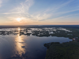 Aerial view over Zuvintas shallow lake Nature Reserve in Lithuania. During late summer evening.