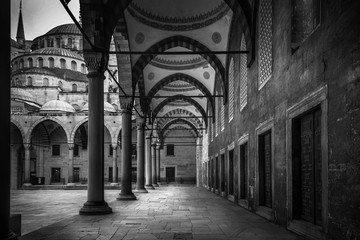 The Sultanahmet Mosque the Blue Mosque alley view from inside in black and white  in Istanbul, Turkey