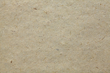 Natural handmade paper with visible plant fibers, texture or background.