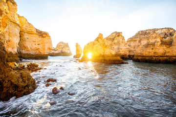 Beautiful landscape view on the rocky coastline on Ponta da Piedade during the sunrise near the Lagos city on the south of Portugal