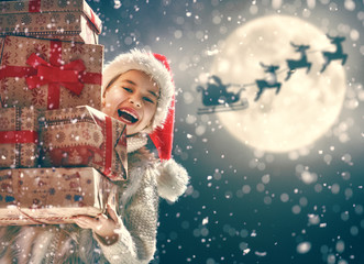 girl with present at Christmas