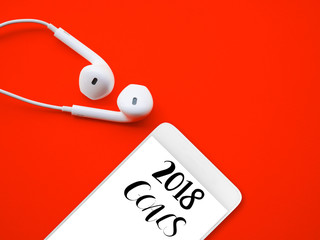 2018 GOALS on smart phone with white earphones on red background