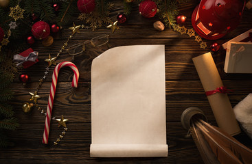 Christmas background, blank paper sheet on wooden table with copy space