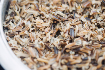 A pot with steamed black rice close-up
