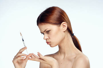 Woman with syringe, Botox, injection, cosmetic procedure