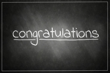 Obraz premium congratulations handwritten in script in chalk on a blackboard. message concept written by chalk , success,congratulations