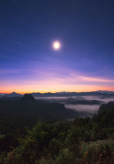 Viewpoint mist mountain colorful with the moon at dawn