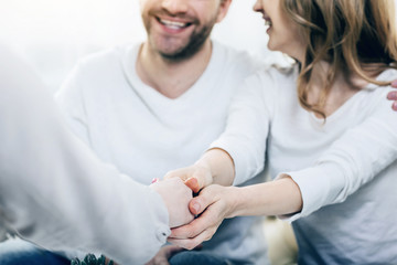 Expression of gratitude. Close up of hands being shacked between a nice professional psychologist and a happy thankful female patient