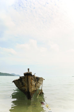 Fishing boat anchored on the shore.