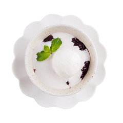 Ice cream in a coconut milk on Black Sticky rice with Mint leaves