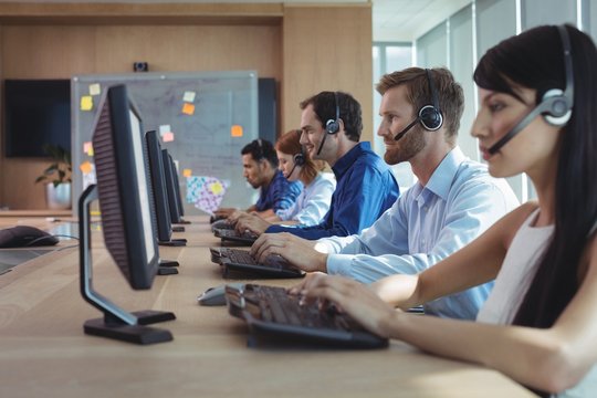 Business colleagues working at call center