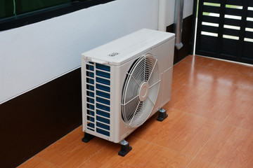 Air conditioner condenser unit on a floor