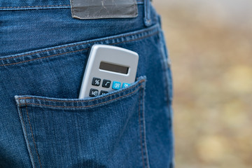 Calculator in a back jeans pocket