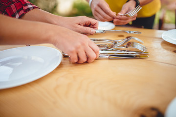 Close up photo of woman holding cutlery