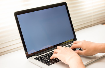 Business Technologies. Workplace with open laptop on modern wooden desk.