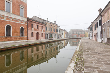 Comacchio (Italy) - Characteristic and fascinating historic town in the Park of the Po Delta, Comacchio has a maze of canals with small bridges and pastel-coloured houses.
