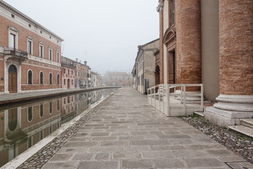 Comacchio (Italy) - Characteristic and fascinating historic town in the Park of the Po Delta, Comacchio has a maze of canals with small bridges and pastel-coloured houses.