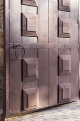 An old front door with a handle to the building. Russia.