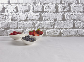 strawberry raspberry blueberry brick wall cocnept