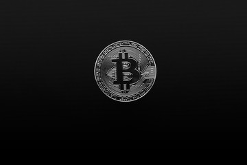 silver bitcoin on black background. Bitcoin cryptocurrency