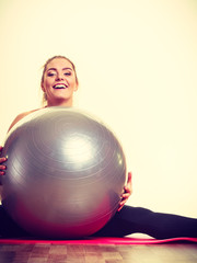 Girl exercising with fit ball