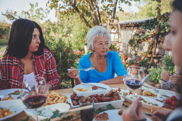 Multi-generation family dining outdoor