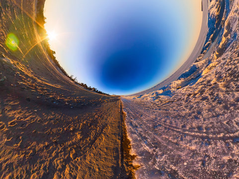 Double sphere sandy beach and the ice of Lake Baikal. Spherical panorama of Little Planet