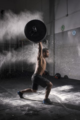 Man Holding a Weight in the Gym