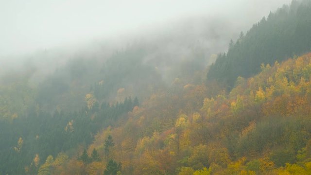 Clouds floating over the autumn Eifel hills in Germany