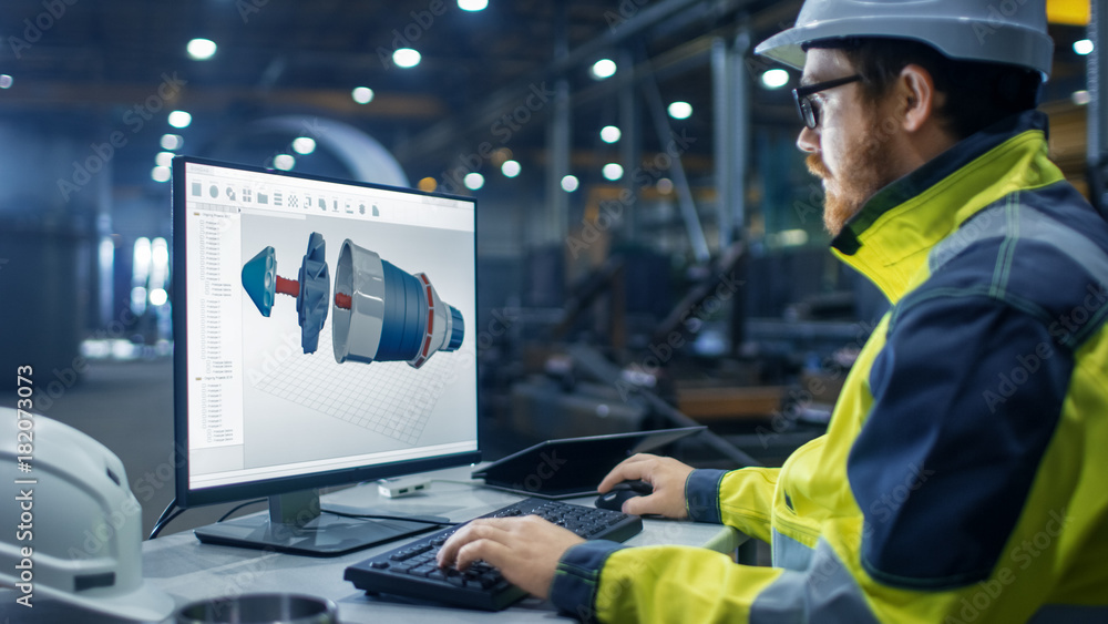 Poster inside the heavy industry factory industrial engineer works on the personal computer designing turbi
