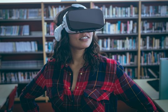 Girl using virtual reality headset in library
