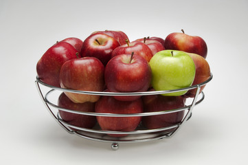 red apples in metal box isolated