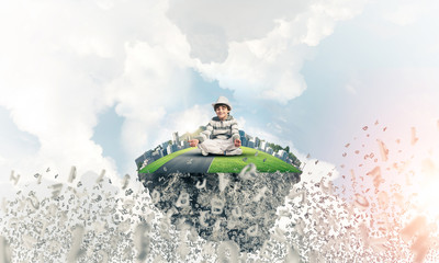 Naklejka premium Little boy keeping mind conscious.