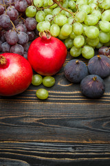 Lots of different fruits on wooden background