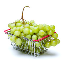 Grapes in shopping cart isolated on white