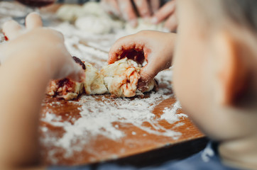 Obraz na płótnie Canvas Detail of hands kneading dough