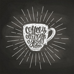 Chalk textured cup silhouette with sunrays and lettering Coffee is always a good idea on black board. Coffee cup with handwritten quote for drink and beverage menu or cafe theme, poster, t-shirt print