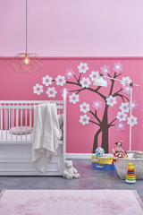 pink baby girl room white baby bed and tree concept on the wall with baby toys interior