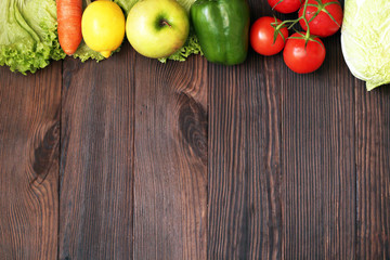 Healthy eating background. Fruits and vegetables on a wooden background