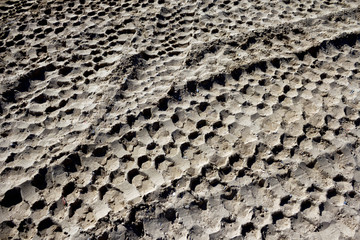 Track of truck wheels on sand 